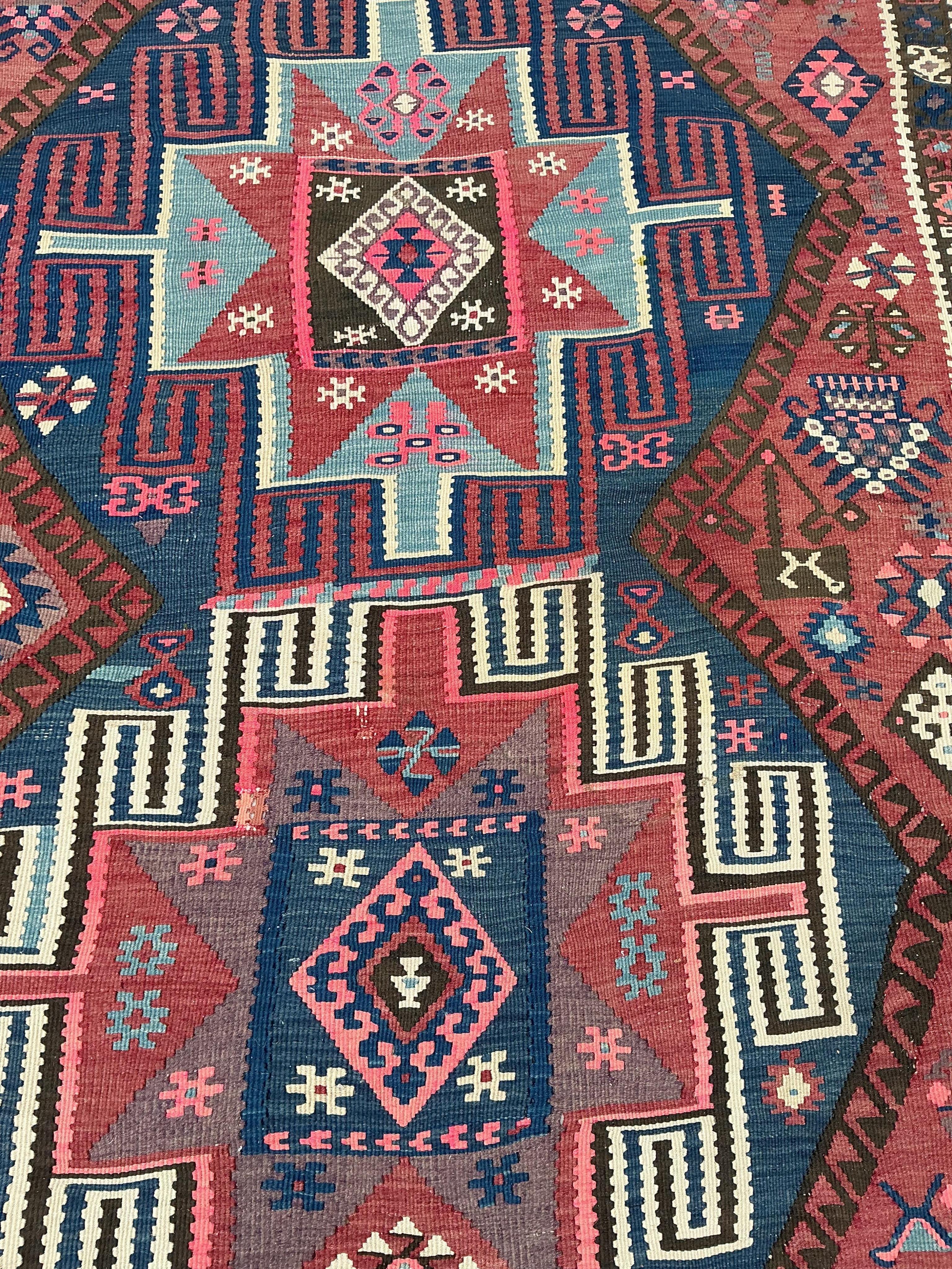 An early 20th century Turkish red ground flat weave Kilim runner, 430 x 138cm